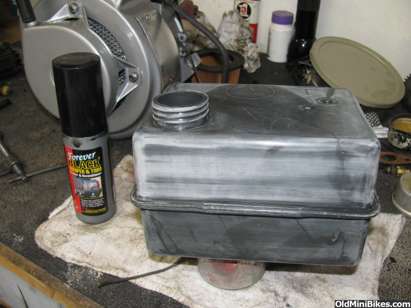 getting paint off a plastic tank?