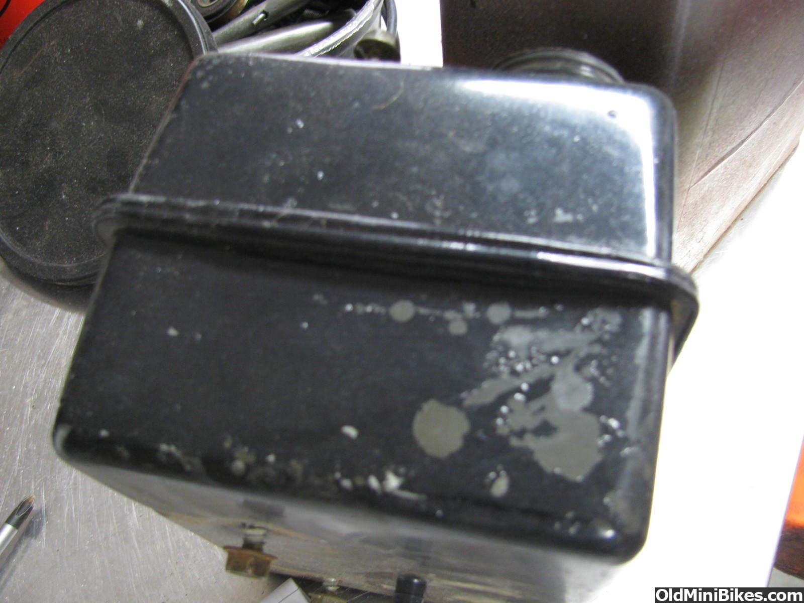 getting paint off a plastic tank?