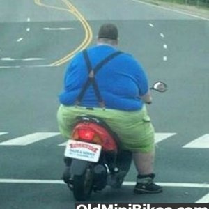 Fat guy on a scooter