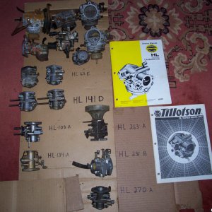pile of tillotson HL carbs with manual