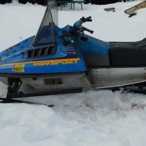 my dads snowmobile with a new seat cover.