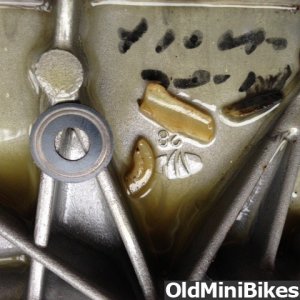 Broken plastic pieces and washer found in crankcase.